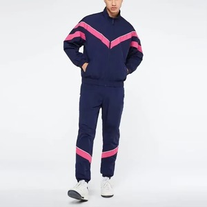 Ensemble de survêtement coupe-vent personnalisé en nylon pour homme : veste de sport zippée et pantalon coupe-vent pour l'entraînement - Product Image 1