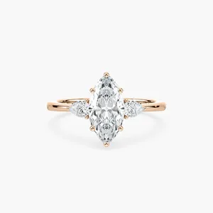 Anillo de compromiso de tres piedras con diamante marquise de 2 quilates y diamantes laterales en forma de pera, elaborado en oro rosa, oro blanco, oro amarillo, elegante. - Product Image 1