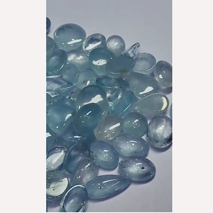 พลอยโทแพซสีฟ้าธรรมชาติ 60 เม็ด ขนาด 16 มม. ถึง 25 มม. รูปทรงวงรีแบบคาโบชอง น้ำหนัก 1500 กะรัต แบบหลังแบน Iroc Sales พลอยหลวมคุณภาพสูง - Product Image 1