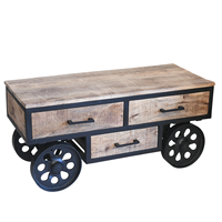 Table basse moderne en bois de manguier massif avec 4 roulettes en fonte et 3 tiroirs de rangement, finition noire et naturelle, style industriel métal et bois