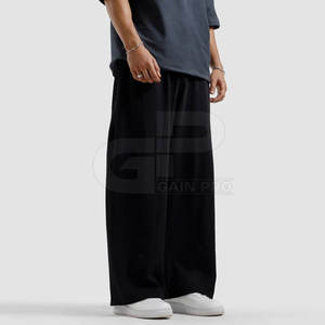 Pantalones deportivos anchos para hombre, de tela elástica cómoda, ideales para entrenamientos en el gimnasio, correr y uso diario. - Product Image 2