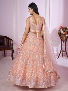 This peach pink lehenga choli blends soft elegance with heavy embroidery Perfect for creating a dreamy festive look - Product Image 3