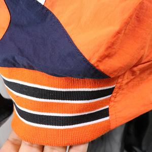 Blouson universitaire homme orange et bleu marine, col montant, fermeture éclair, coupe-vent sportif, design à patchs brodés, color block, Urban Productions - Product Image 6
