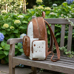 Custom logo cowhide leather hair on <b>backpacks</b> wholesale OEM supplier premium export quality student bags for sale in pakistan - Product Image 3