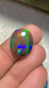 Opale noire d'Éthiopie naturelle, cabochon ovale, pierre précieuse en vrac, effet de jeu de couleurs, pour la fabrication de bijoux - Product Image 1