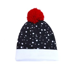Black Knitted <b>Beanie</b> <b>with</b> White Dot Pattern, Folded Cuff and Red <b>Pom</b> <b>Pom</b> - Product Image 1
