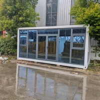 Maison préfabriquée en conteneur en verre moderne et portable pour bureau, boutique, studio et usage commercial