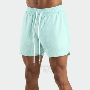 กางเกงขาสั้นกีฬาเอวกลาง ระบายอากาศได้ดี น้ำหนักเบา ป้องกันรอยยับ สำหรับผู้ชาย ออกกำลังกายที่ยิม ขายส่ง - Product Image 1