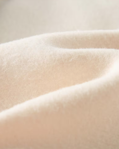 Cream Soft Knit Fabric Textured <b>Cloth</b> <b>Material</b> Close Up View - Product Image 3