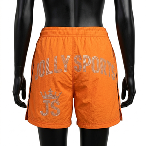 Short coupe-vent pour femme en nylon Taslon premium 120 GSM, orange vif avec empiècements latéraux noirs, logo personnalisé en strass - Product Image 2