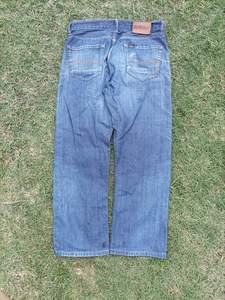 Jeans pour hommes en denim écoresponsable, coupe évasée, délavage noir, orné de strass, style urbain, vente en gros usine - Product Image 4