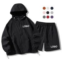 Ensemble de survêtement unisexe coupe-vent à capuche avec cordon de serrage, logo personnalisé, 2 pièces, veste à manches longues et short en nylon, pour l'entraînement