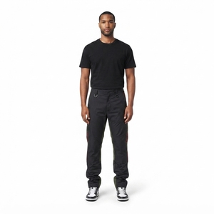 Pantalones de hombre M-01 Kinetic Stacked personalizados, de nylon ripstop sin lavar, con bordado pan-africano, sostenibles y que mantienen la forma. - Product Image 1