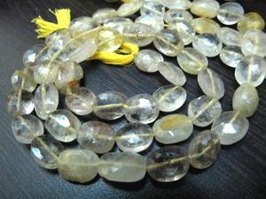 Cuentas de cuarzo rutilado dorado natural, facetadas ovaladas tipo briolette, de 10 a 12 mm, se venden por hebra de 13 pulgadas. - Product Image 3