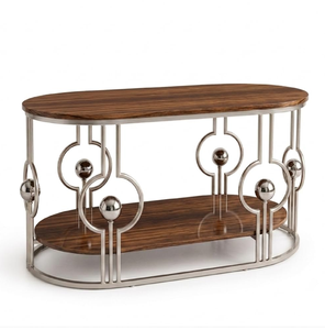 Mesa de centro redonda con tablero de mármol blanco y estructura de alambre metálico dorado entrecruzado, disponible a precios de mayorista. - Product Image 2