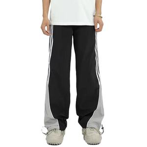 Pantalon de survêtement évasé vintage 2026 pour homme avec logo personnalisé, rayures droites et courbes, en nylon, coupe coupe-vent, OEM - Product Image 1