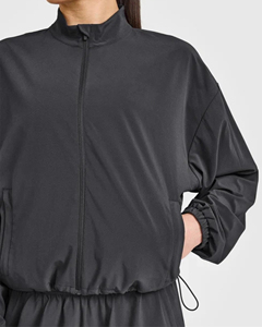 Chaqueta cortavientos casual personalizada para mujer con cremallera completa, cuello alto, hombros caídos, para correr, venta al por mayor, con dobladillo elástico - Product Image 5