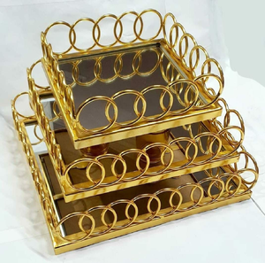 Set of three square gold mirrored cake <b>risers</b> featuring <b>linked</b> ring metal borders, available at wholesale prices. - Product Image 1