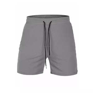 Pantalones cortos de gimnasio tejidos de algodón 100% diseñados por el fabricante Pantalones cortos deportivos de secado rápido para hombres Logotipo personalizado Impreso Patrón sólido Decoración - Product Image 1