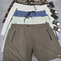 Shorts Homme Respirants en Polyester Effet Rafraîchissant Séchage Rapide Protection UV Anti-Frottement Athlétique Décontracté Été Taille Élastique Plage