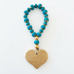 Guirlande de perles en bois faites à la main avec pompon en jute et croix, perles de prière style ferme-bohème pour décoration murale et plateau à étages - Product Image 1