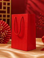 Sac cadeau en papier d'art rouge personnalisé de style chinois avec motif en relief et poignée en corde tressée pour mariage, festival, emballage de thé