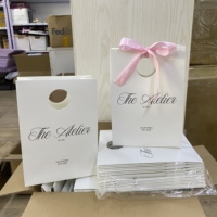 Sacs en papier personnalisés écologiques en gros pour cadeaux et shopping avec marque privée
