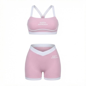 Ensemble de yoga 2 pièces North Approach rose avec soutien-gorge de sport à bretelles croisées et short taille haute, bordure contrastante, sans couture et respirant - Product Image 1