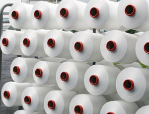 Exportateur de fil de polyester 100% NE 10s/1 pour le tissage, fil à âme filée écologique et antibactérien en provenance d'Inde - Product Image 2