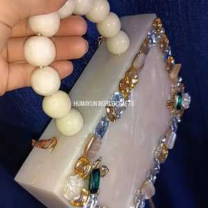 Elegant white resin clutch with beaded handle, <b>crystal</b> embellishments, and gold chain for weddings and parties. - Product Image 3