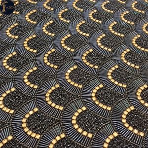 Tissu en maille noir riche orné de perles avec motifs en cristaux dorés |   Broderie de perles en forme de trompette argentées et bronze pour robes de cocktail et robes - Product Image 1