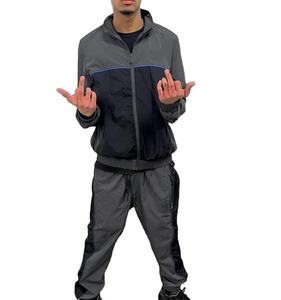 ชุดวอร์มสะท้อนแสง 2 ชิ้น ชุดจ็อกกิ้งผ้าไนลอนยับทรงโอเวอร์ไซส์ เสื้อแจ็คเก็ตกันลม กางเกงขายาว ชุดเซ็ตแทรคสูทสำหรับผู้หญิง - Product Image 1