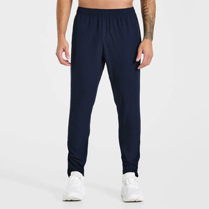Pantalones deportivos casuales para hombre con logotipo personalizado, cintura elástica con cordón, bolsillos laterales y puños con cremallera, tela transpirable tejida a bajo precio al por mayor - Product Image 1