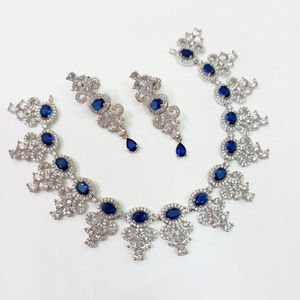 Ensemble collier et boucles d'oreilles de mariée en strass bleus – Bijoux de mariage élégants plaqués argent pour les mariées et les occasions spéciales - Product Image 1