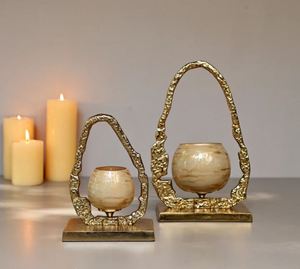 Gglass votive holder has a golden finish on <b>top</b> and a metal gold frame is made of sturdy aluminium - Product Image 2
