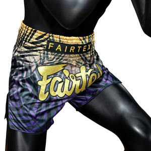 กางเกงมวยไทย Fairtex สีม่วงดำทอง พิมพ์ลายแบบ Sublimation Transfer ผลิตจากโพลีเอสเตอร์ 100% ยืดหยุ่น แห้งเร็ว เหมาะสำหรับ MMA ทั้งชายและหญิง - Product Image 4