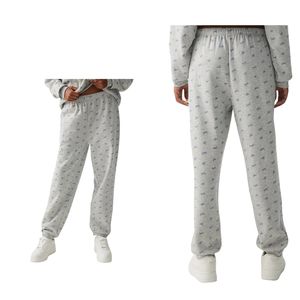 กางเกงวอร์มพิมพ์ลายสีเทาสำหรับผู้หญิง เอวยางยืด สวมใส่สบาย ผลิตจากผ้าฝ้าย รับผลิตตามแบบ พร้อมสกรีนโลโก้ ขายส่ง OEM - Product Image 1