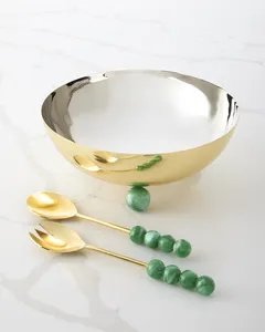 Bol de service en métal doré avec poignées perlées vertes et ustensiles assortis pour une mise en scène de table glamour - Product Image 1