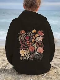 Combina una parte frontal oscura y minimalista con un estilo artístico botánico vintage en la parte posterior para un look urbano sofisticado. - Product Image 3