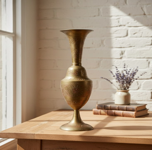 Vintage brass pedestal vase showcasing intricate engraved <b>floral</b> motifs and a classic tapered silhouette, at wholesale prices. - Product Image 1