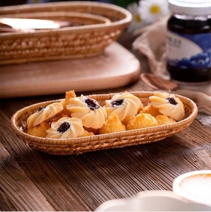 Cesta de almacenamiento de ratán ovalada de bambú natural hecha a mano en forma de círculo para servir y exhibir alimentos en la cocina - Product Image 2