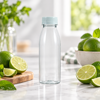 Bouteilles rondes transparentes en PET pour jus et boissons avec bouchons à vis en plastique pour l'emballage de boissons vides et la distribution au détail