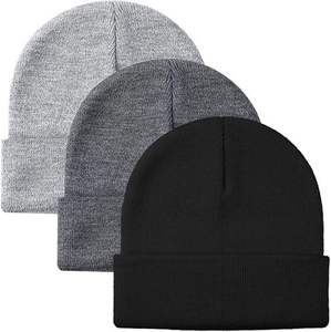 Bonnet personnalisé avec pompon et revers, fabriqué par une usine de bonnets tricotés sur mesure pour les marques de vêtements d'hiver - Product Image 1