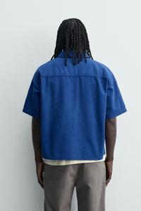 Polo homme sur mesure en coton doux bleu foncé avec col demi-zip et poche, vente en gros - Product Image 2
