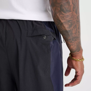 Pantalon de survêtement blanc surdimensionné pour homme, coupe large, avec empiècements latéraux contrastants noirs et détails de passepoil, taille à cordon de serrage, 100% coton, vente en gros sur mesure - Product Image 4
