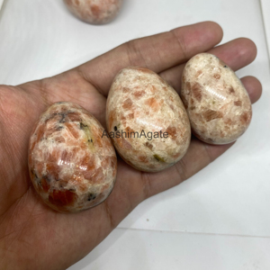 Œuf de cristal de pierre de soleil naturelle poli, pierre précieuse de guérison pour le Reiki, la méditation, les chakras et la décoration intérieure - Vente en gros - Product Image 3