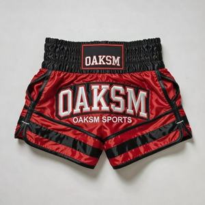 Pantalones Cortos de Muay Thai Personalizados en Satén Naranja y Negro con Logotipo Elástico OEM, Pantalones Cortos de Muay Thai Personalizados en Satén Naranja con Logotipo Bordado - Product Image 2