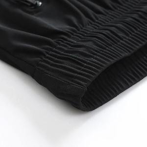 Pantalon de survêtement noir pour homme, taille élastique avec cordon de serrage, décontracté, respirant, poches latérales, en polyester tricoté, idéal pour l'automne - Product Image 3