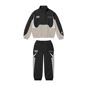 Jogging en nylon personnalisé vestes zippées pantalons de survêtement deux pièces polyester respirant ensemble coupe-vent vêtement imprimé d'hiver - Product Image 1