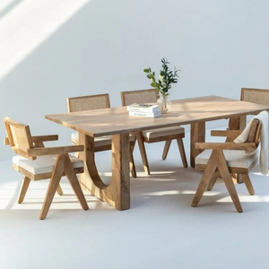 Collection de salle à manger en teck massif monumentale avec base sculpturale artisanale et fauteuils en rotin tressé - Product Image 1